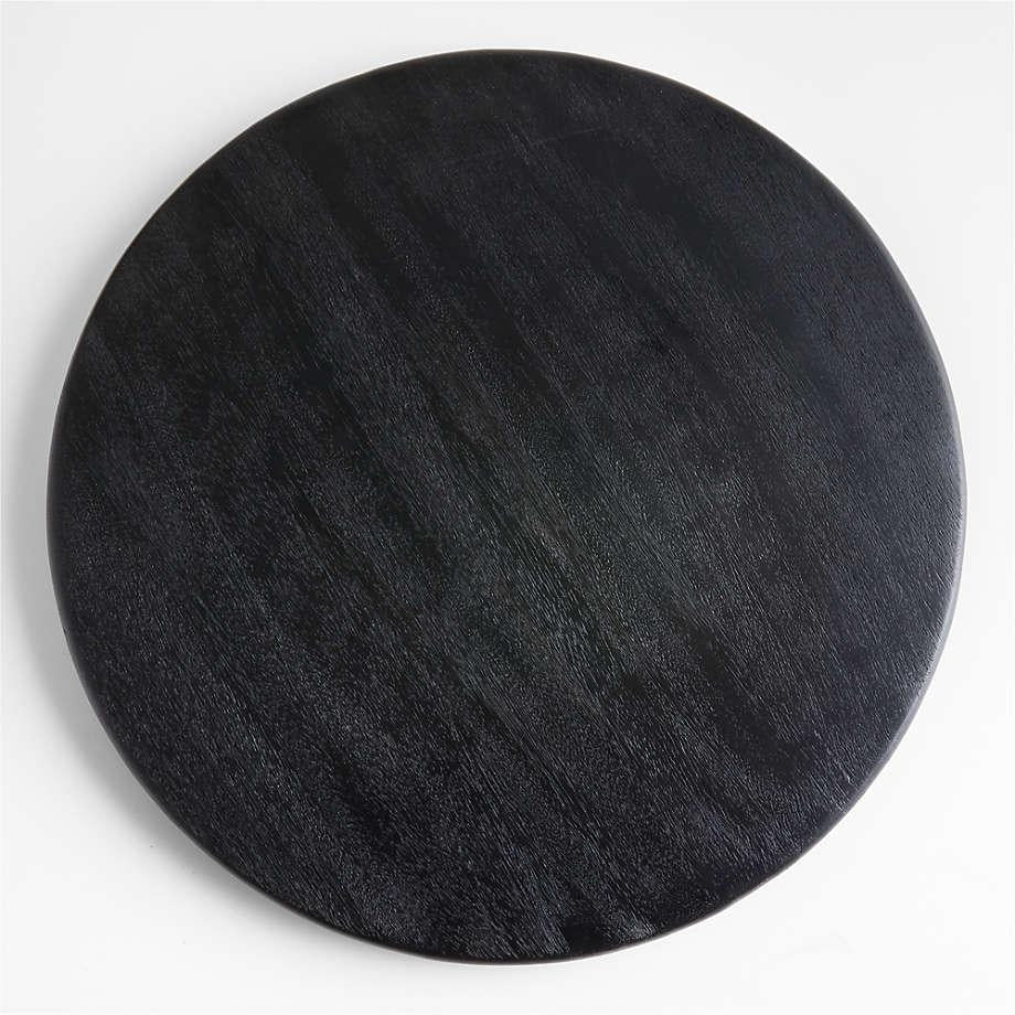 Round black ash wood cutting board with subtle wood grain and smooth rounded edge, shown flat on a white background.
