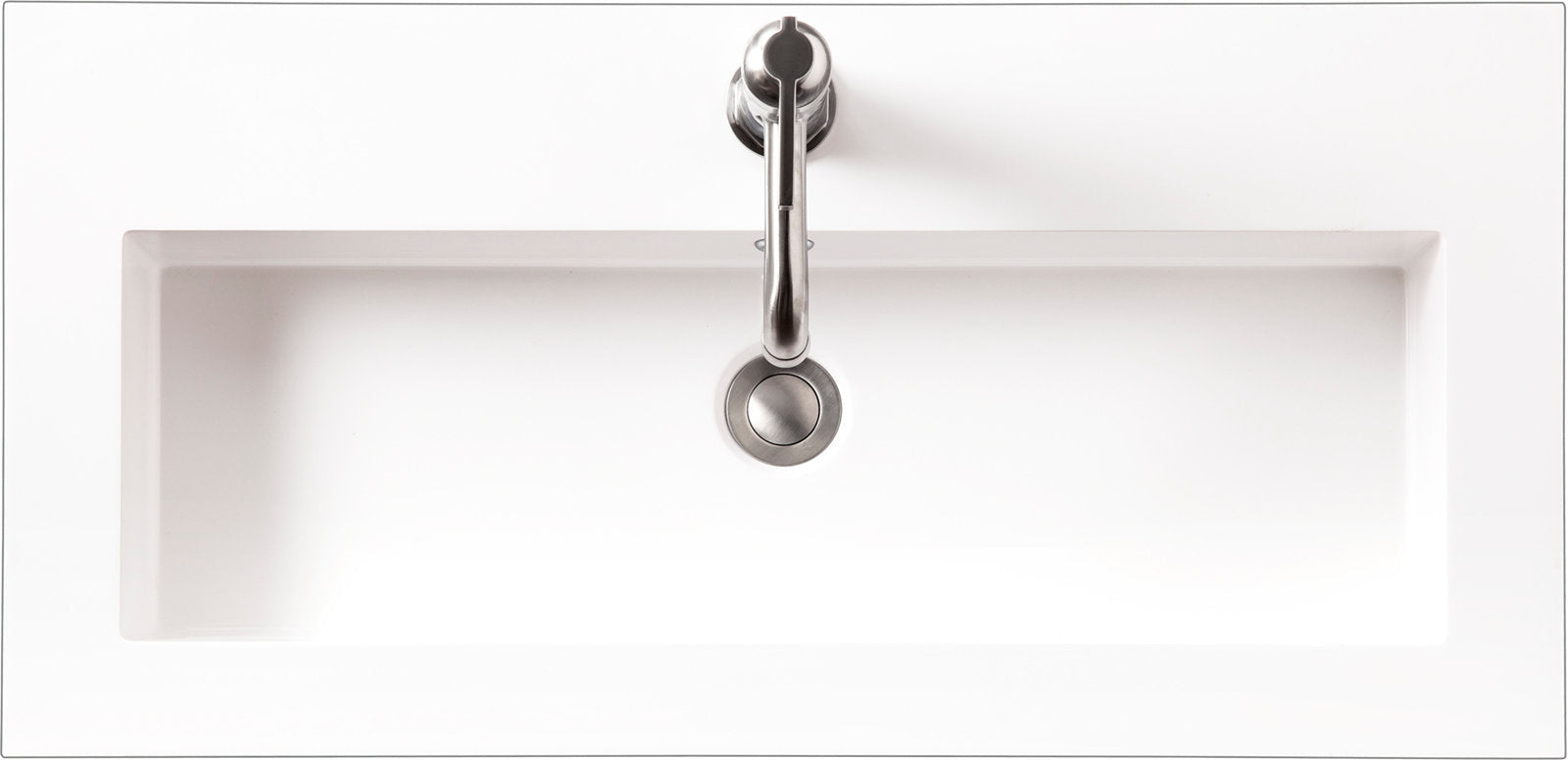 Top-down view of a rectangular white ceramic sink integrated into a stone vanity top, with a centered single-handle stainless faucet and round pop-up drain in a modern bathroom vanity.