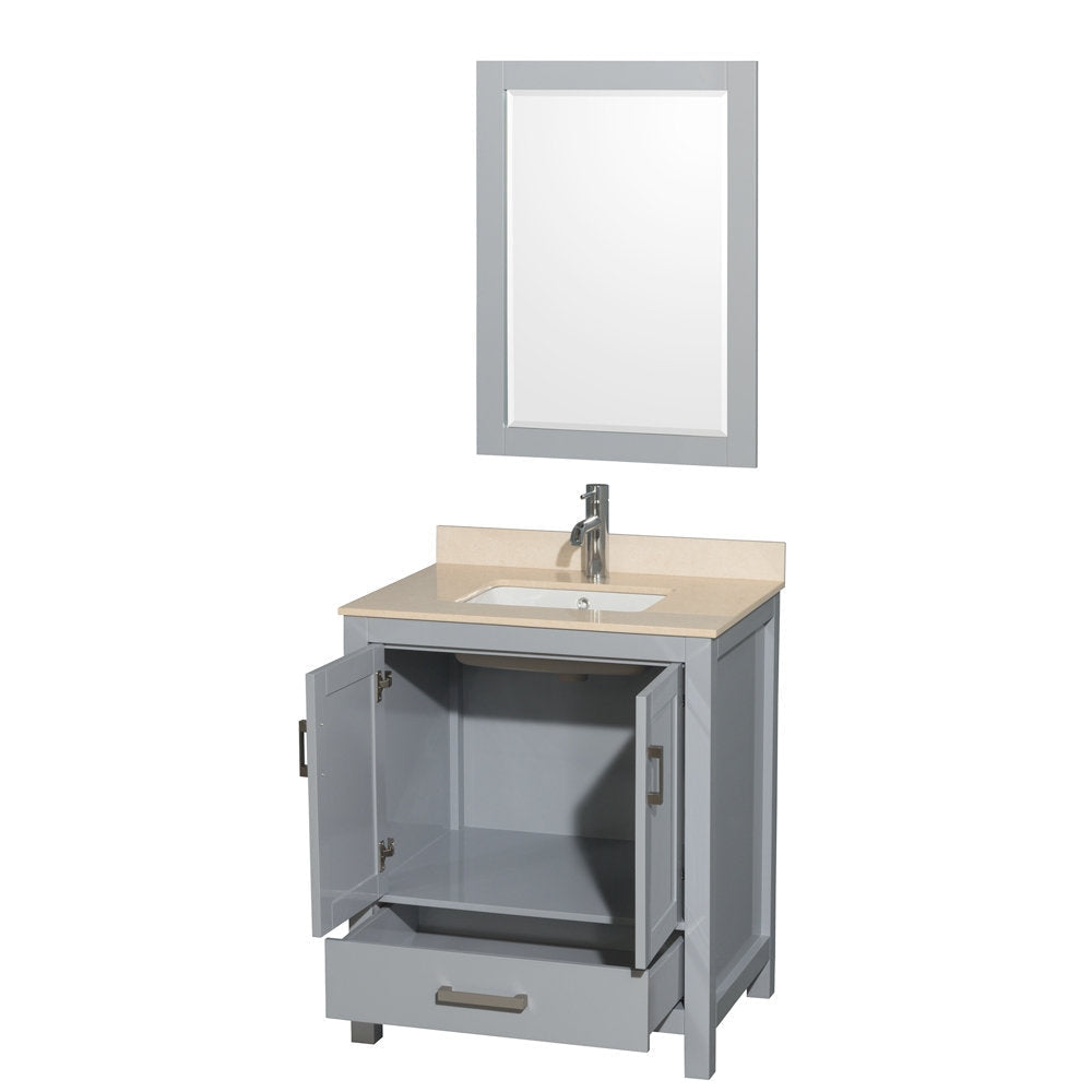 Contemporary freestanding gray solid wood bathroom vanity with a stone countertop and undermount ceramic sink, single chrome faucet, matching gray framed mirror above; cabinet doors open and bottom drawer partially extended.