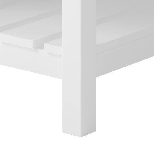 Close-up of a white solid-wood square leg and slatted lower shelf on a modern freestanding bathroom vanity.