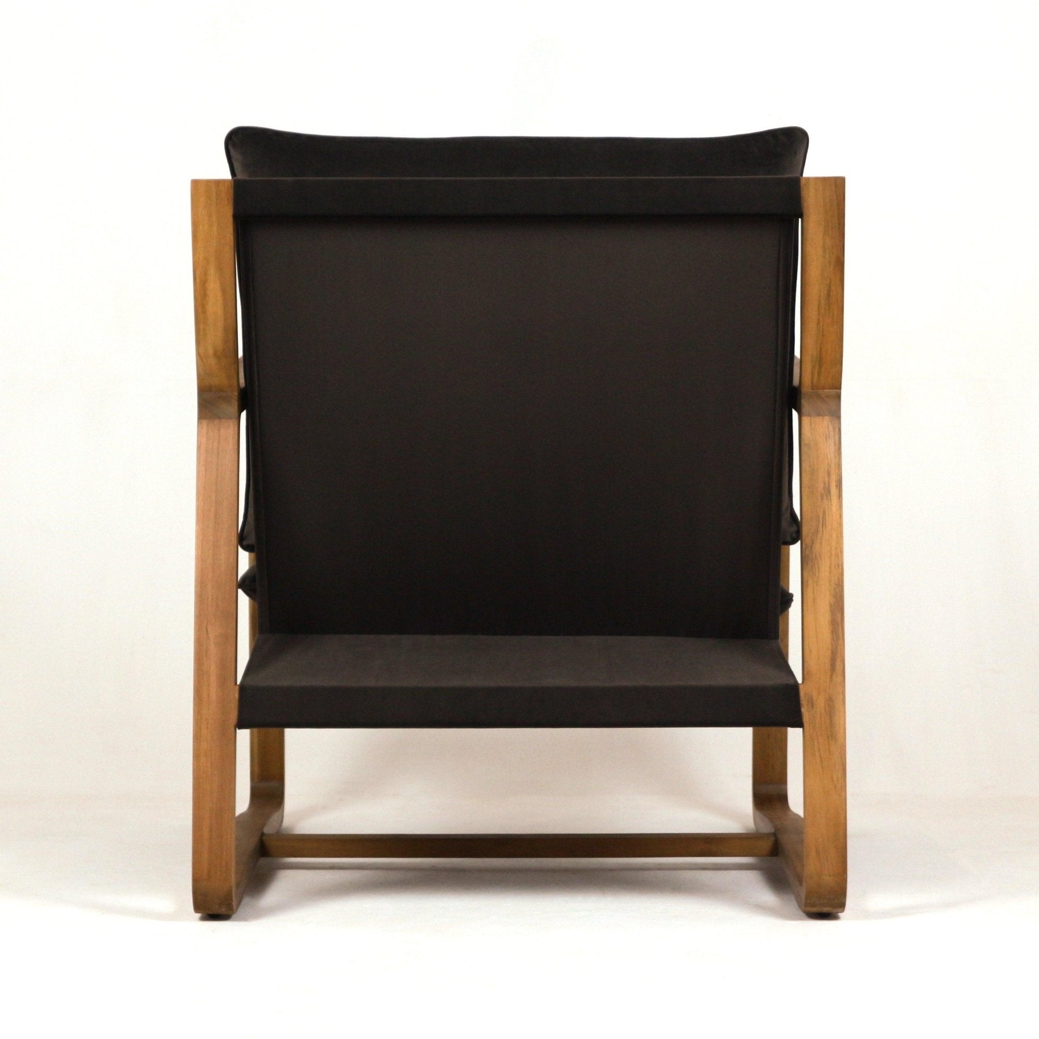 Back view of a mid-century modern accent chair featuring a solid oak frame and dark olive-green velvet upholstery with a low-profile seat and exposed wooden legs.