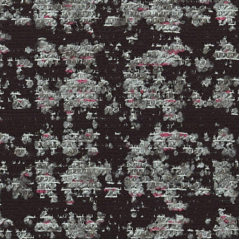 Close-up of viscose-blend black upholstery fabric showing textured gray and white woven loops with small pink accent threads in an irregular speckled pattern.