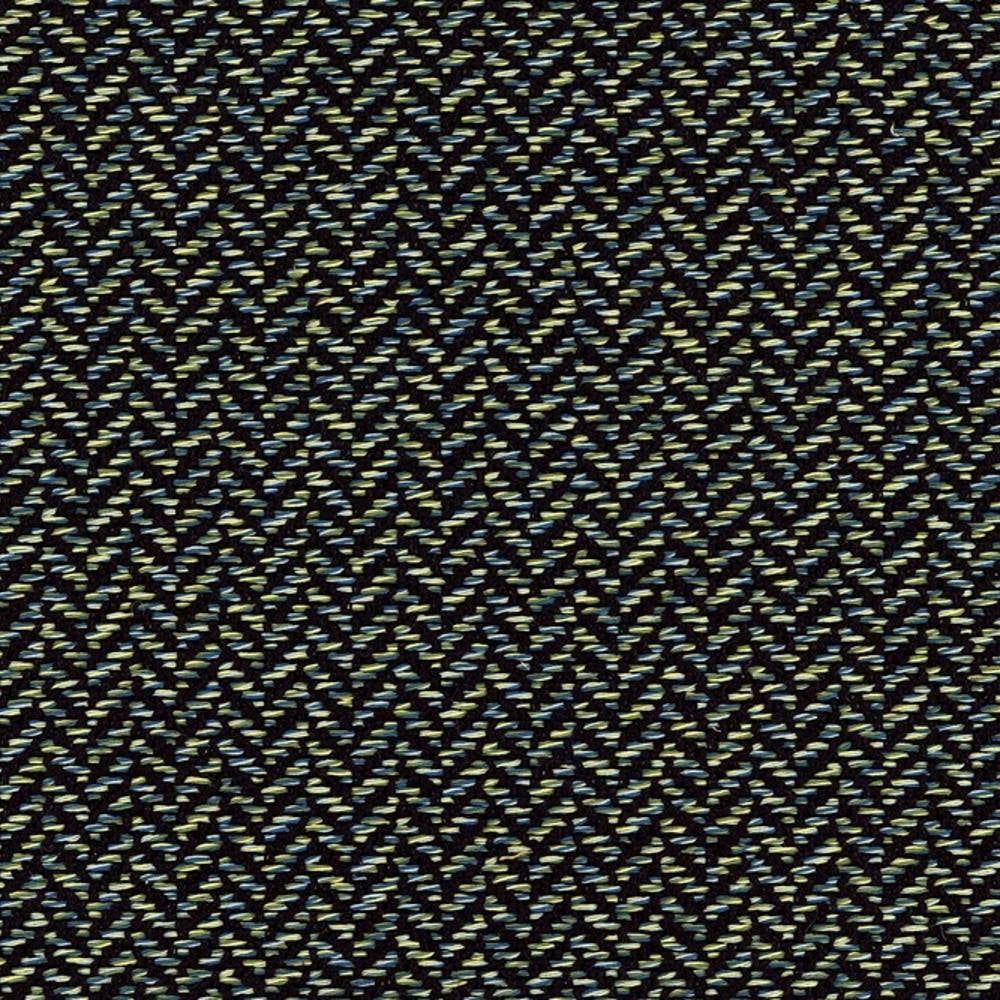 Close-up of woven upholstery fabric (38% rayon, 62% polyester) on a dark neutral ground with lime-green and teal flecks forming a subtle herringbone chevron pattern, a modern contemporary texture for sofas and office seating.