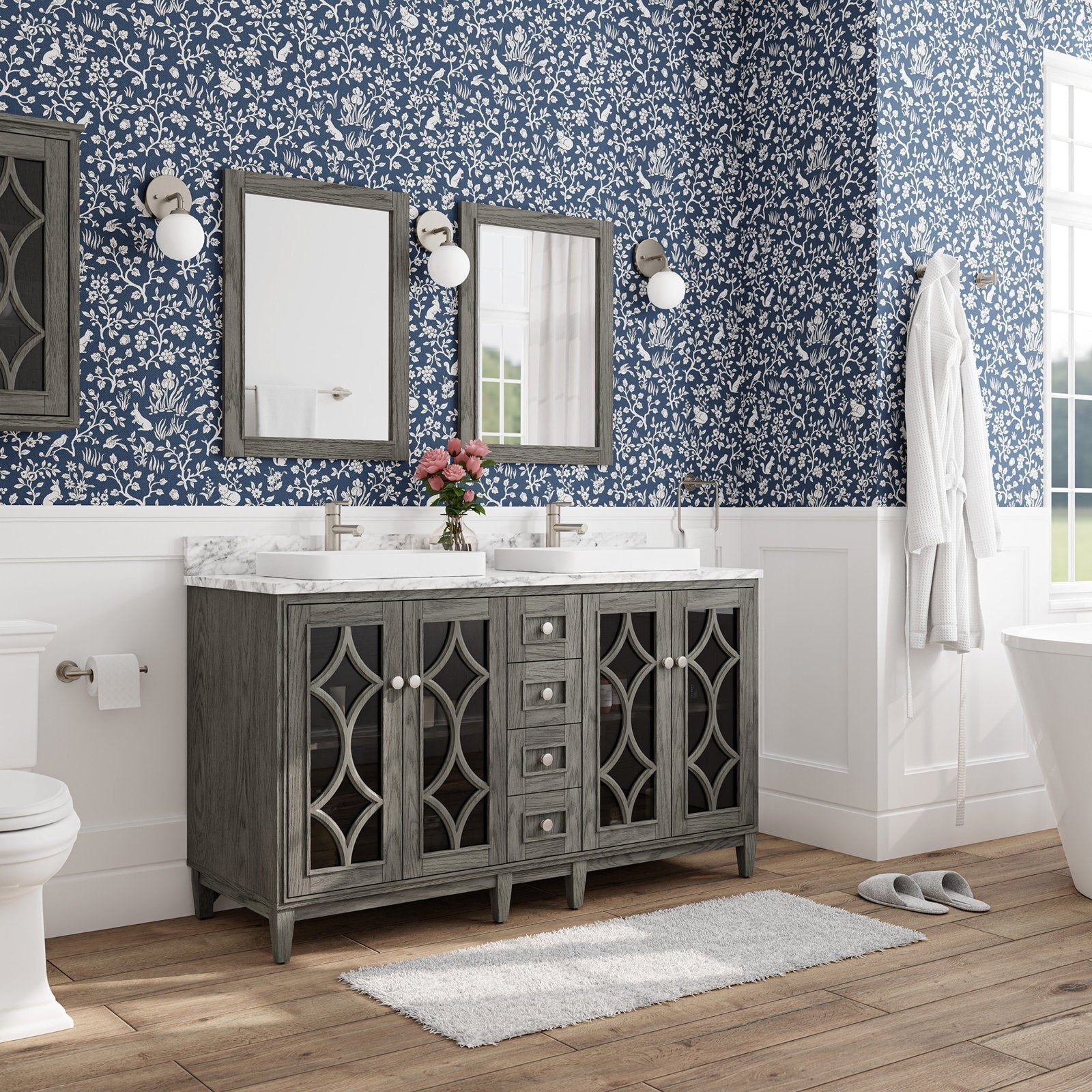 Modern freestanding solid-wood 60-inch double bathroom vanity with a stone marble top, two rectangular white vessel sinks and brushed-nickel faucets, gray decorative glass cabinet doors, wood-framed mirrors and globe sconces.