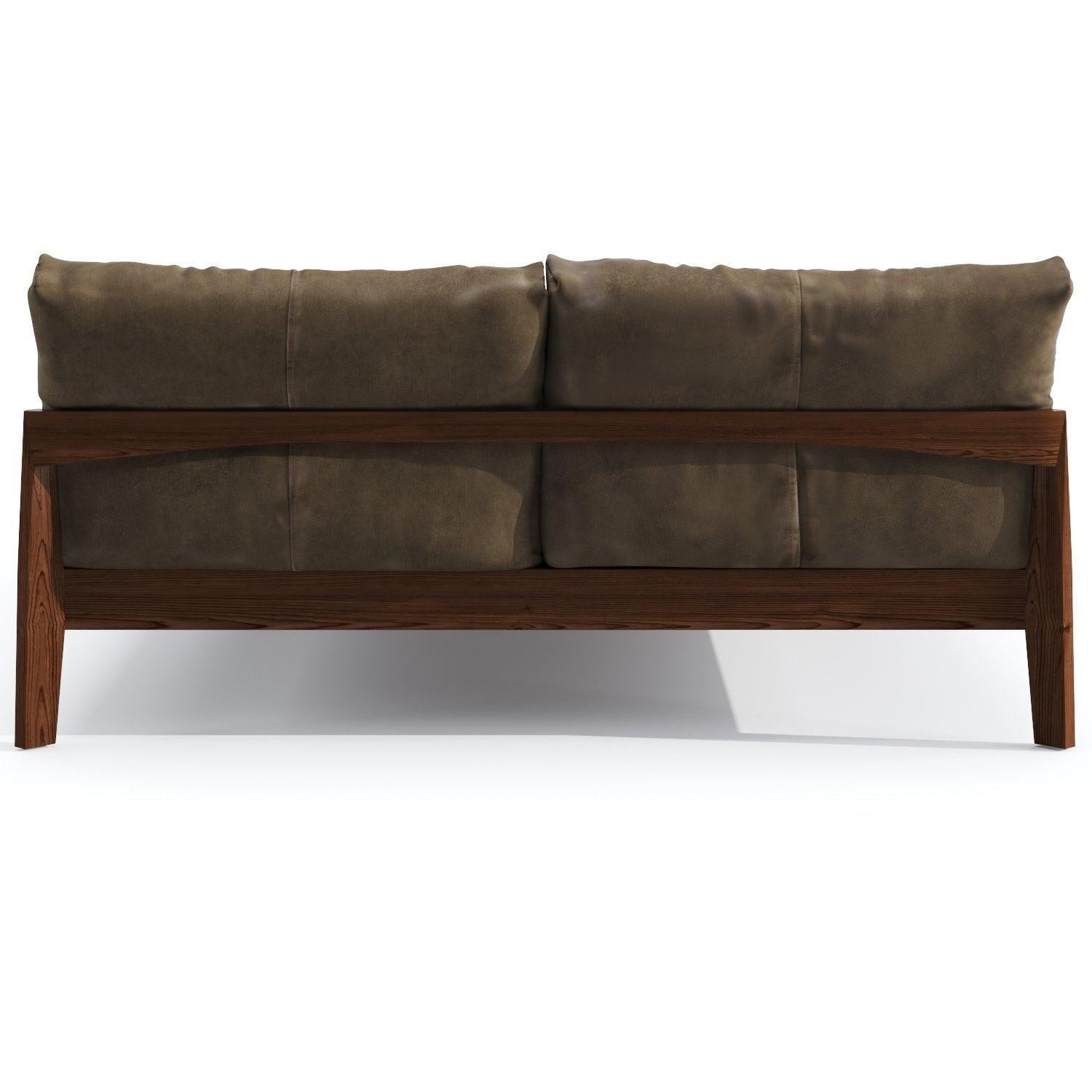 Rear view of a king-size teak bed with a solid teak frame and angled legs, featuring two large brown suede-like cushions forming a padded headboard in a mid-century modern platform design.