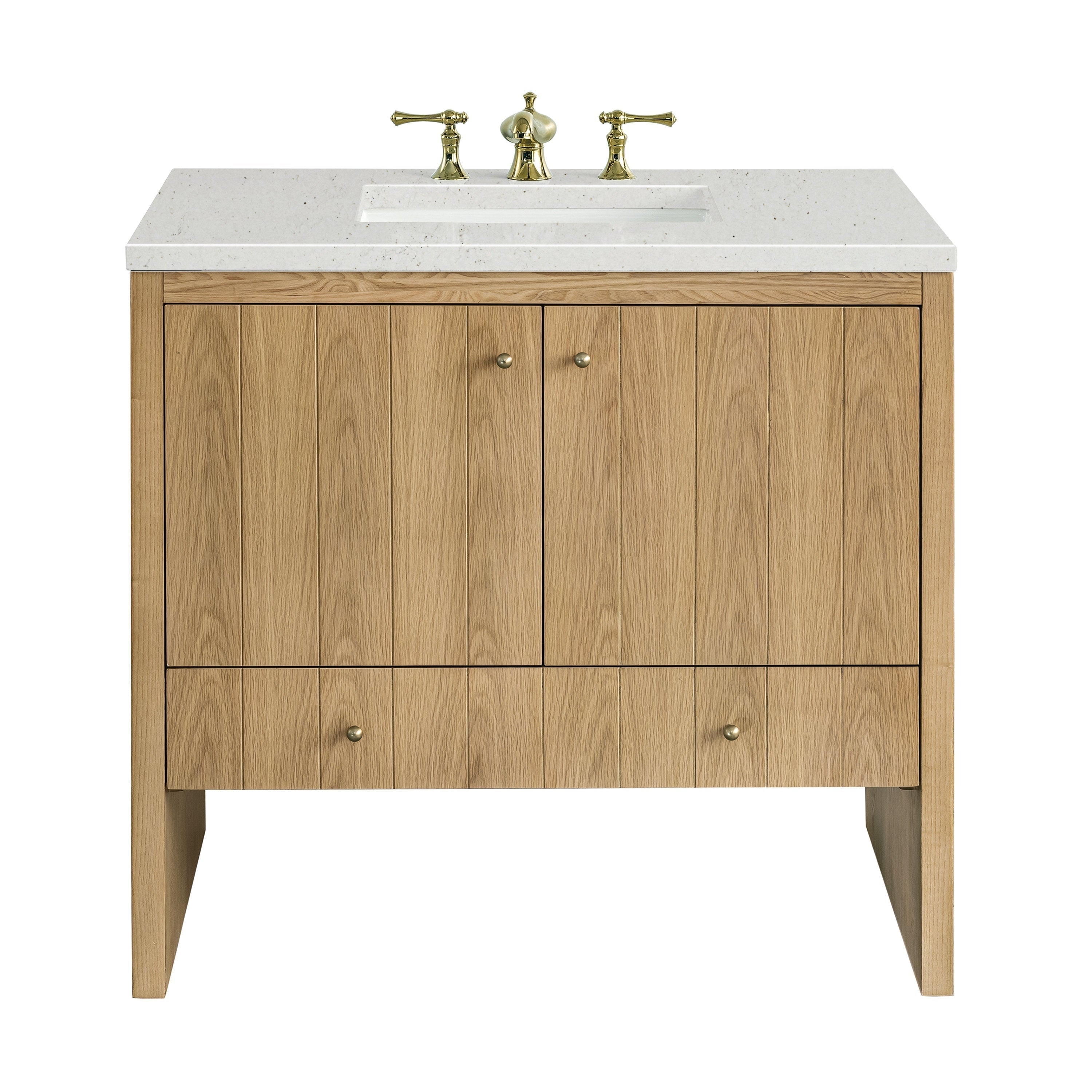 The NUEMA Sala 36 Single Bathroom Vanity features solid oak construction, vertical panels, two central cabinet doors, a lower drawer, a white stone countertop with inset sink, and gold faucet handles in a modern minimalist design.