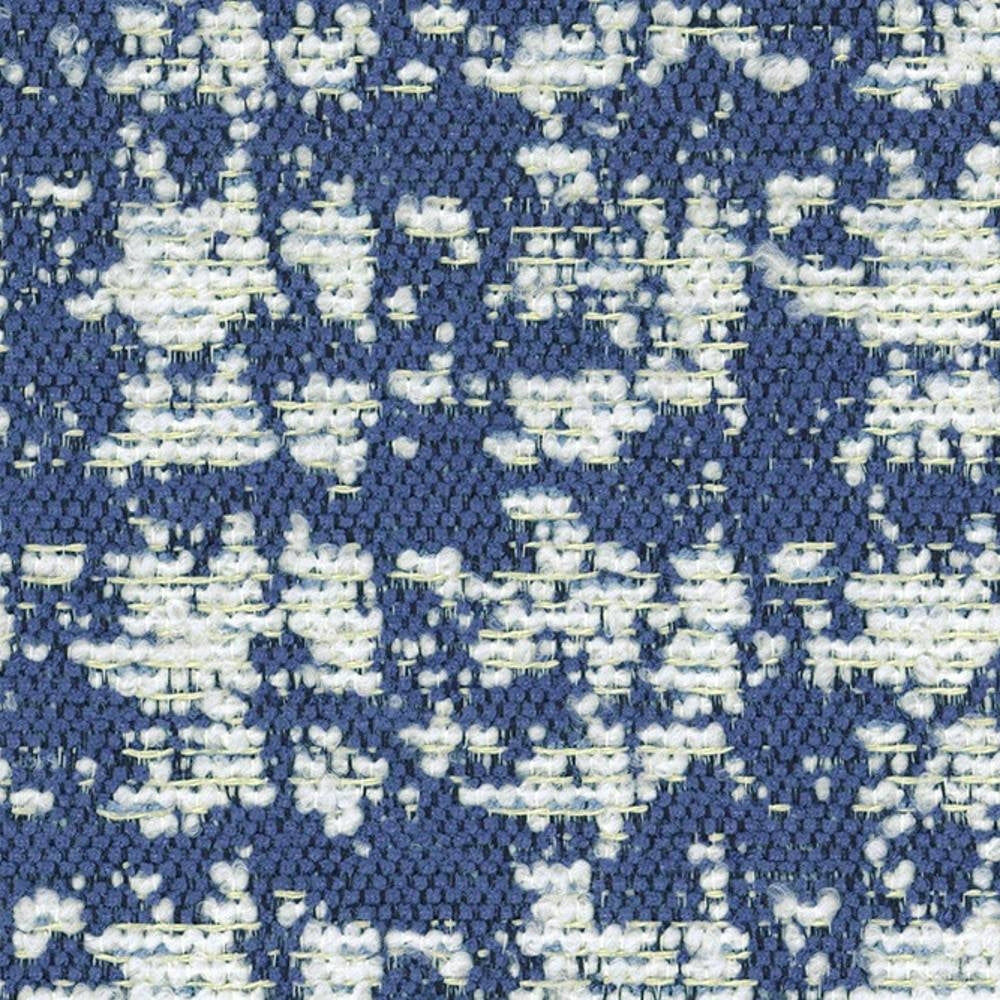 Close-up of blue and white woven upholstery fabric showing looped bouclé yarns and an irregular contemporary pattern, ideal for sofas; composition 41% viscose, 9% acrylic, 50% polyester.