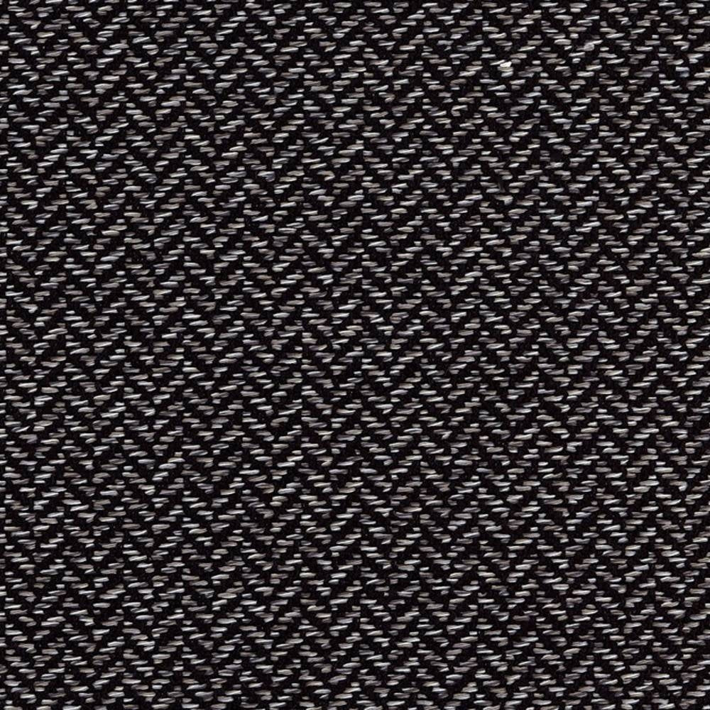 Close-up of a neutral woven upholstery fabric showing a dense small-scale herringbone chevron pattern in dark and light threads; 38% rayon, 62% polyester, for contemporary and modern sofas or office seating.