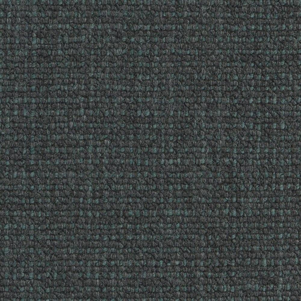 Close-up of dark charcoal fabric with subtle teal flecks and a tight boucle looped weave, suitable for sofa upholstery; 18% wool, 67% acrylic and 15% polyester.