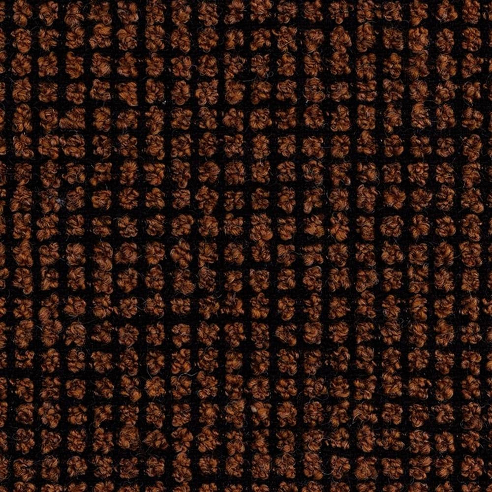 Close-up of boucle sofa upholstery showing a dark brown looped-yarn grid on a black woven ground; 25% wool, 40% acrylic, 35% polyester blend highlighting textured, durable woven loops.